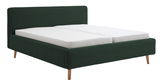 Polsterbettgestell in dunklem Grün mit Holzfüßen, seitliche Perspektive