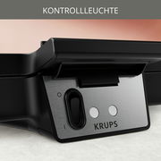 Nahaufnahme eines Waffeleisens mit Kontrollleuchte und Schalter, seitliche Perspektive