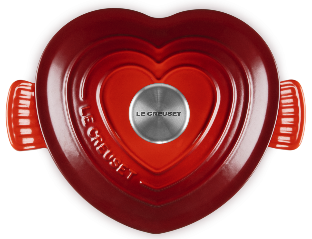 Herzförmiger Bräter in Kirschrot von oben, mit Le Creuset Logo auf dem Deckel.
