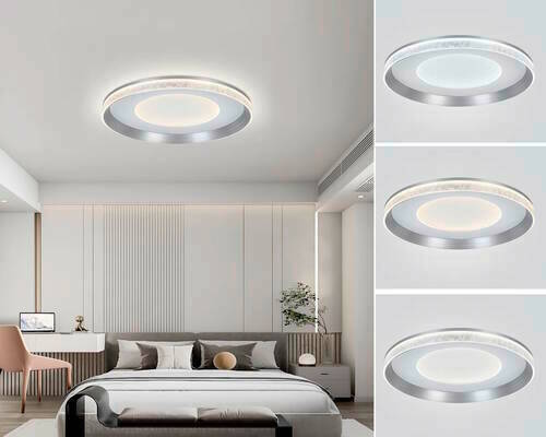 Moderne LED-Deckenleuchte in einem Schlafzimmer, aus der Perspektive von unten betrachtet, mit einem eleganten, runden Design und einem silbernen Rahmen.