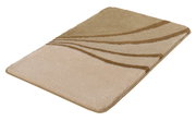 Beiger Badteppich mit wellenförmigem Muster in verschiedenen Brauntönen, perspektivisch von der Seite fotografiert.