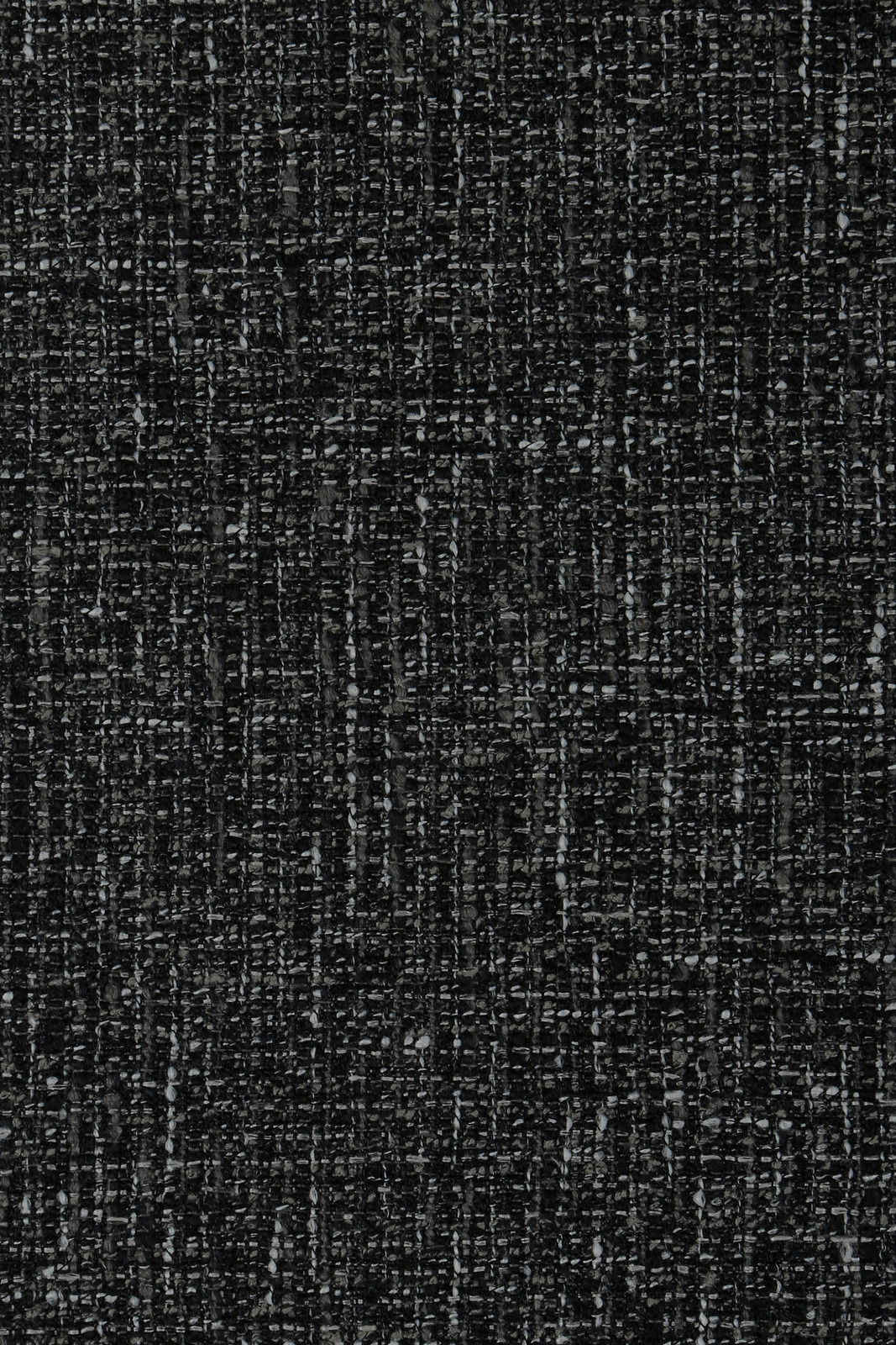 Novel Armlehnstuhl ELVIY Nahaufnahme eines dunkelgrauen, strukturierten Stoffes, der für einen Armlehnstuhl verwendet wird.