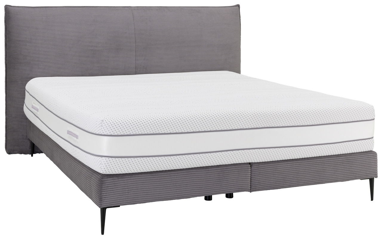 Boxspringbett mit grauem Stoffbezug und weißer Matratze, seitliche Perspektive