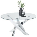Moderner Couchtisch mit runder Glasplatte und verchromtem Kreuzfuß, seitliche Perspektive, dekoriert mit schwarzer Vase und Glas.