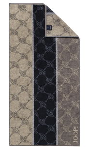 Duschtuch mit elegantem Muster in Beige- und Grautönen, von oben fotografiert.