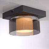 Moderne Deckenleuchte RIKA mit schwarzem Sockel und rauchgrauem Glas, seitliche Perspektive