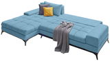 Blaue Ecksofa Rundecke Ottli mit Kissen und Decke, Perspektive von schräg vorne