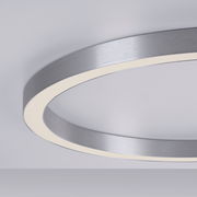 Moderne Deckenleuchte PURE-LINES von Paul Neuhaus in seitlicher Perspektive, mit einem eleganten, runden Design und einem silbernen Rahmen.