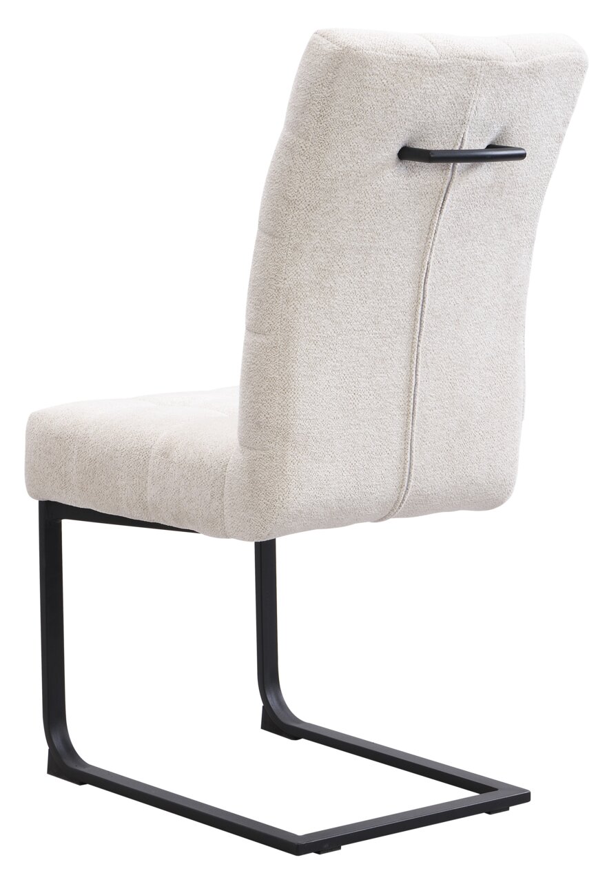 Z2 Schommelstoel MARLON Achterkant van een moderne schommelstoel met een lichte stoffen bekleding en een zwart metalen frame.