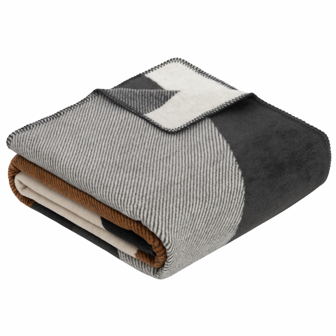 Gefaltete Jacquard Decke in Grautönen mit geometrischem Muster, seitliche Perspektive