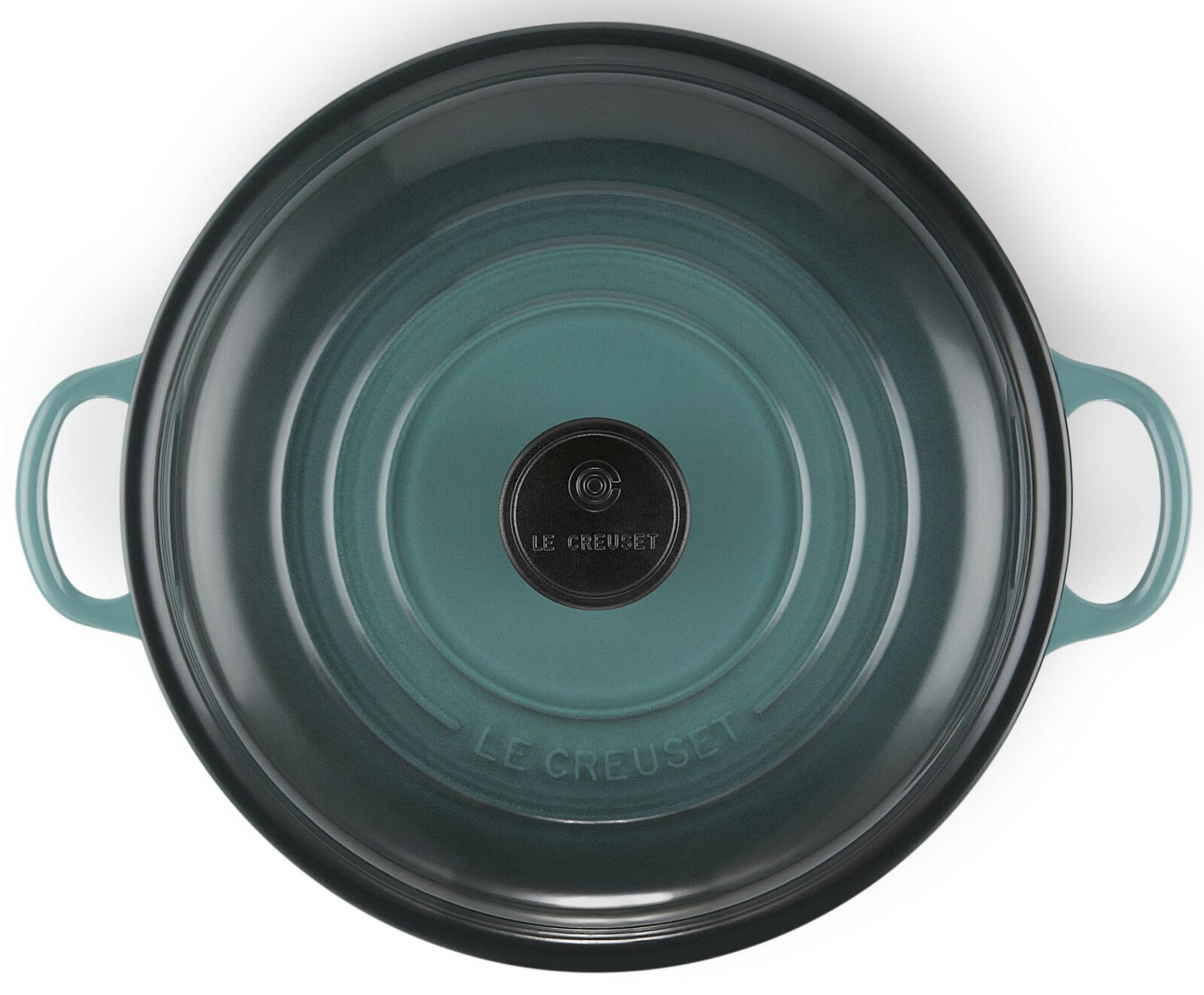 Obere Ansicht einer runden, türkisfarbenen Servierpfanne mit zwei Griffen und einem schwarzen Knauf auf dem Deckel.