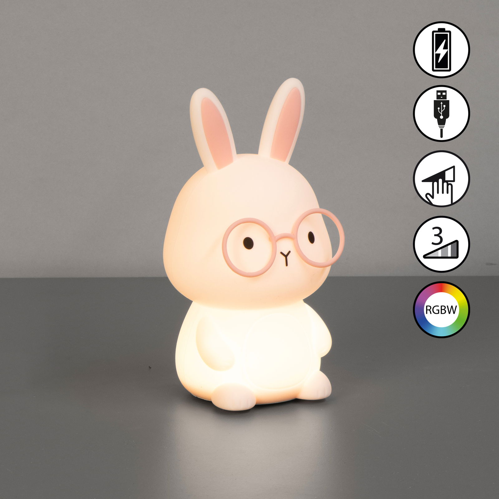 Niedliches Akku-Nachtlicht in Form eines Hasen mit Brille, von vorne betrachtet. Es leuchtet sanft und bietet RGBW-Farboptionen sowie eine USB-Ladefunktion.