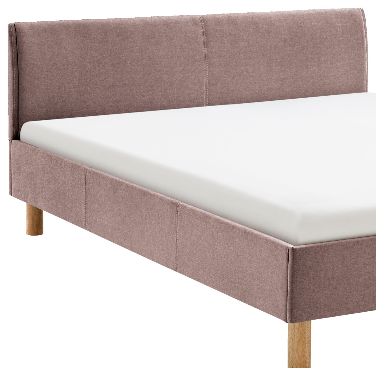 Gestoffeerd bed in roze met houten poten, zijaanzicht