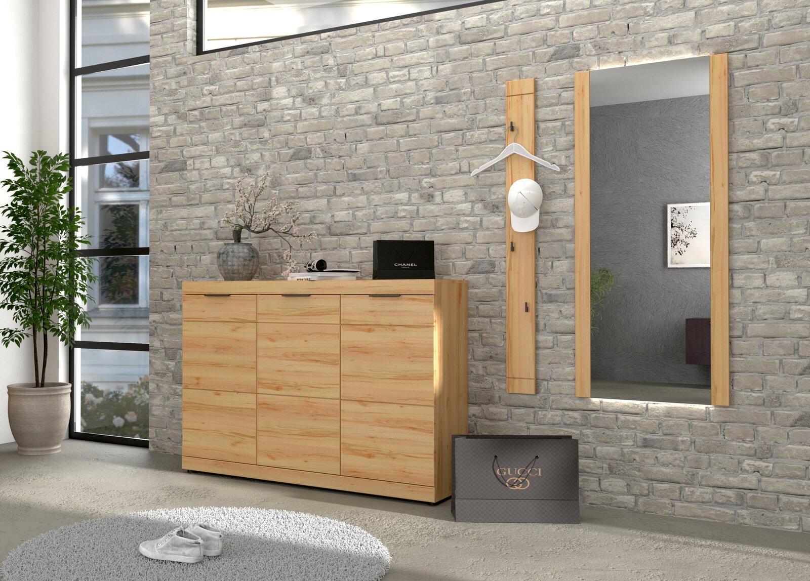 Moderne Garderobe im Flur: helles Holz-Sideboard mit drei Türen vor grauer Ziegelwand, daneben Wandspiegel und Garderobenpaneel mit Kleiderbügel und weißer Kappe, perspektivisch in leichter Schrägansicht von vorn.