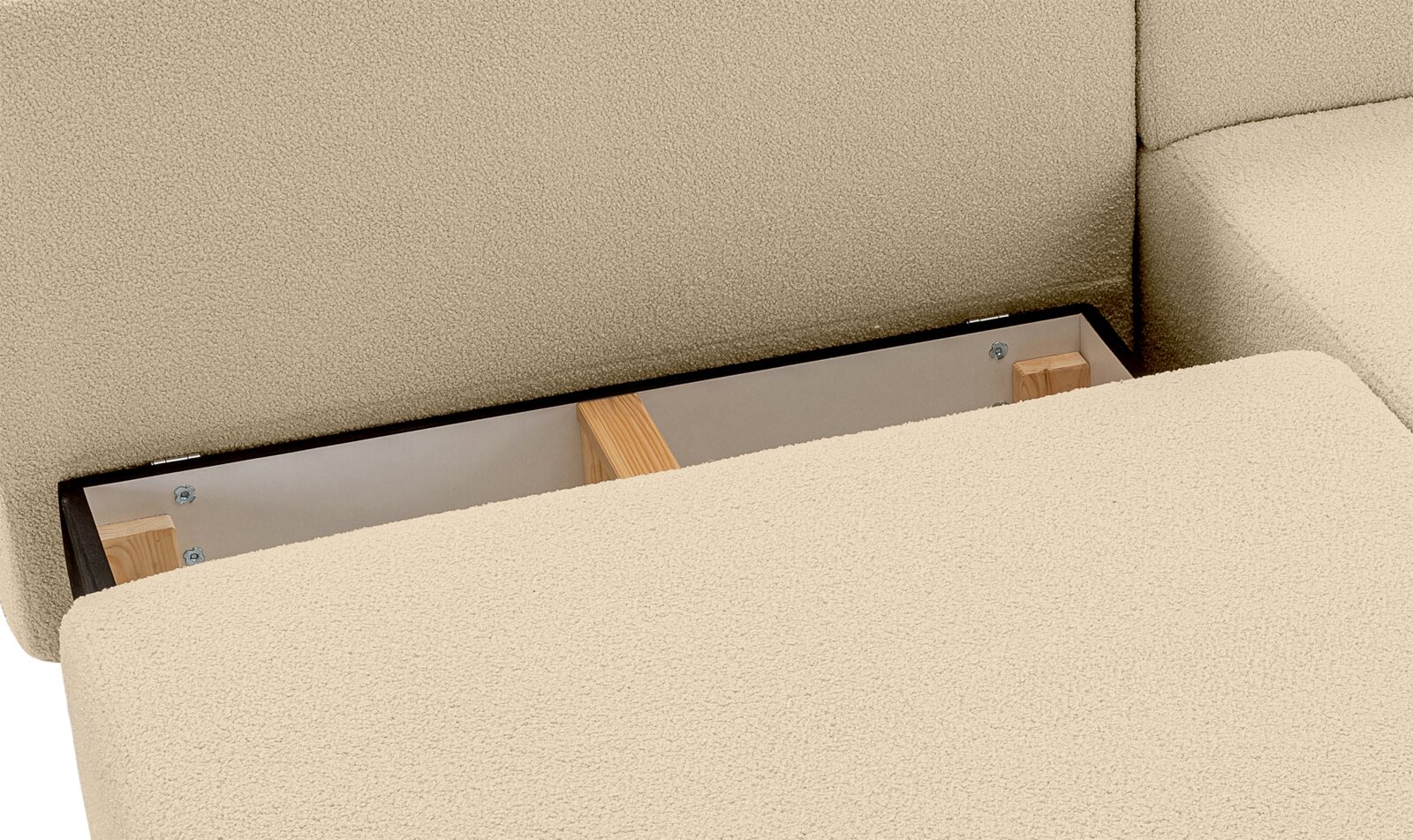 Nahaufnahme eines Schlafsofas in L-Form mit Stauraum unter der Sitzfläche, Perspektive von oben.
