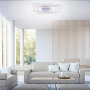 Moderne plafondlamp INIGO in een stijlvolle woonkamer, gezien vanuit een laag standpunt.