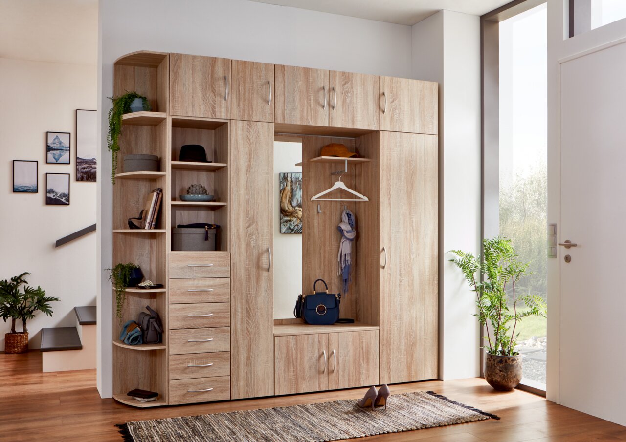 XORA Kommode MULTIRAUMKONZEPT Mehrzweckschrank in Holzoptik mit mehreren Fächern und Schubladen, frontal fotografiert.