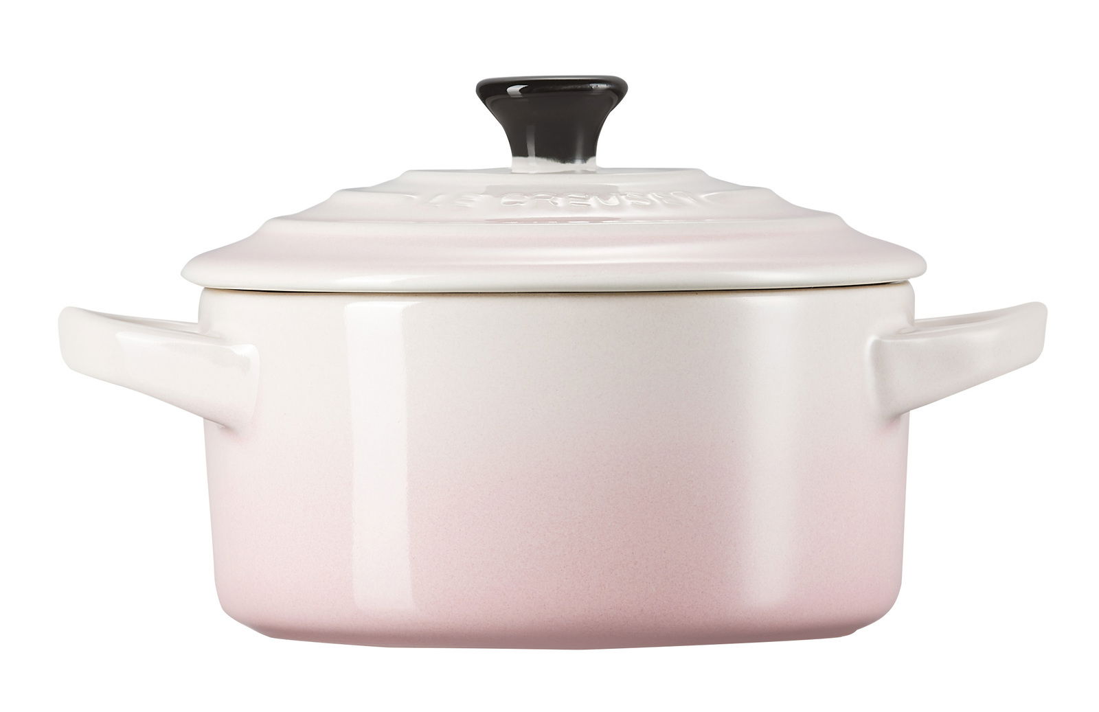 Frontale Ansicht einer Mini-Cocotte in Muschelrosa mit schwarzem Knauf und zwei seitlichen Griffen.
