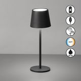 Schwarze Akku-Tischleuchte ROXI mit modernem Design, zylindrischem Lampenschirm und runder Basis, aus seitlicher Perspektive fotografiert. Symbole für Akku, USB, Touch-Steuerung, CCT und IP44 Schutzart sind sichtbar.