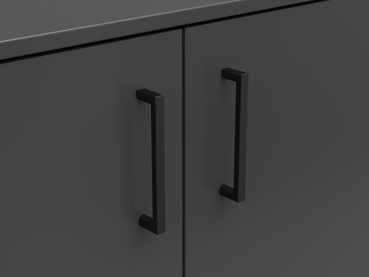 Nahaufnahme einer dunklen Kommode mit zwei schwarzen Griffen, Frontalansicht.