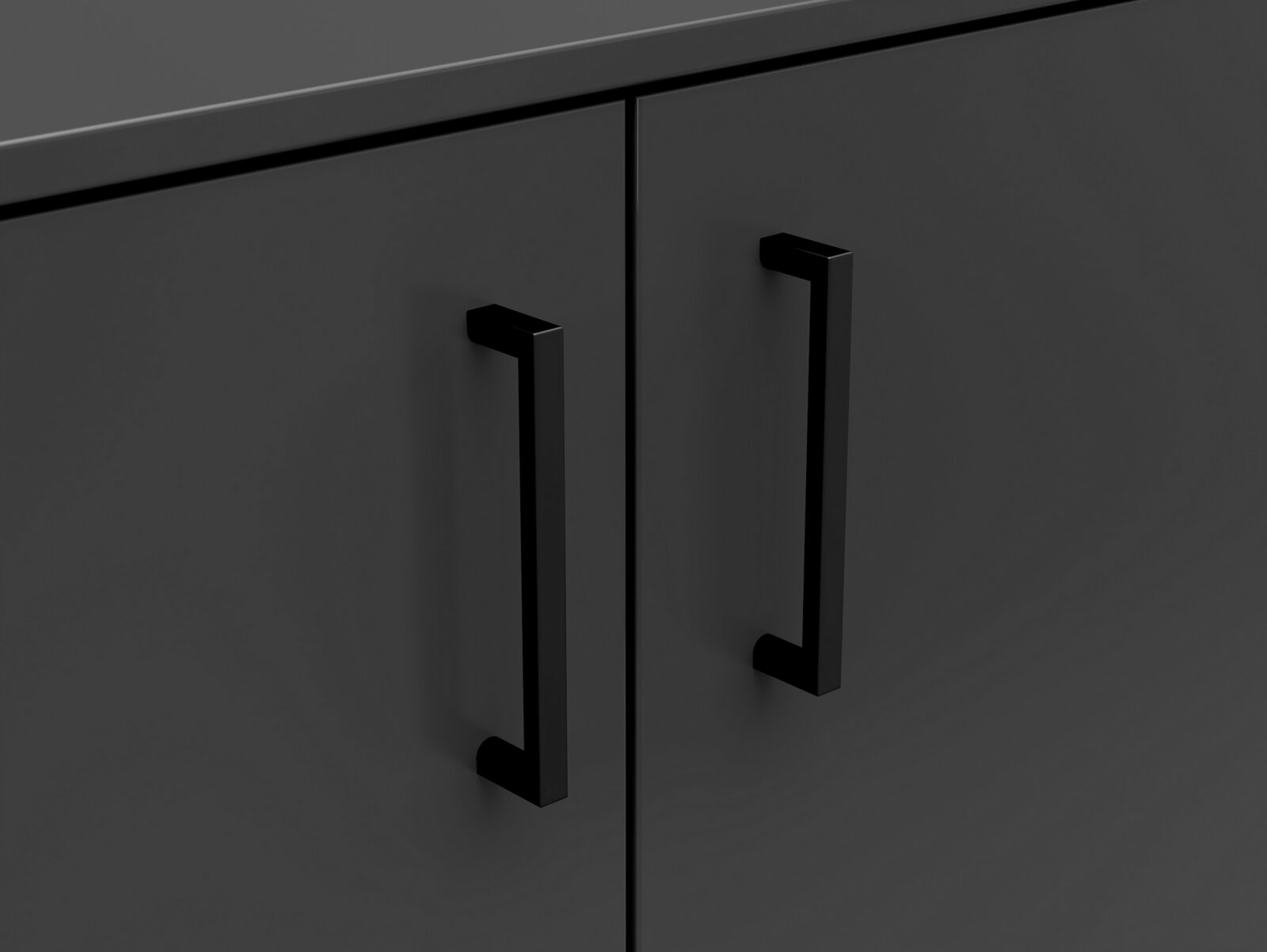 Nahaufnahme einer dunklen Kommode mit zwei schwarzen Griffen, Frontalansicht.