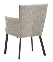 Rückansicht eines Armlehnstuhls mit beigem Stoffbezug und schwarzen Metallbeinen.