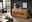 Holz-Sideboard MERAN in einem modernen Wohnzimmer, frontal fotografiert, mit dekorativen Vasen und Büchern darauf.