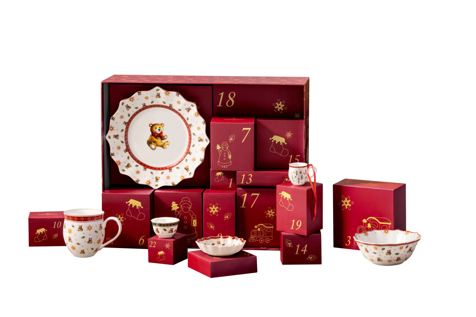 Weihnachtlicher Porzellan-Adventskalender mit 24 roten Geschenkboxen und festlich dekoriertem Geschirr mit Teddybärmotiven, frontal aus leichter Vogelperspektive präsentiert