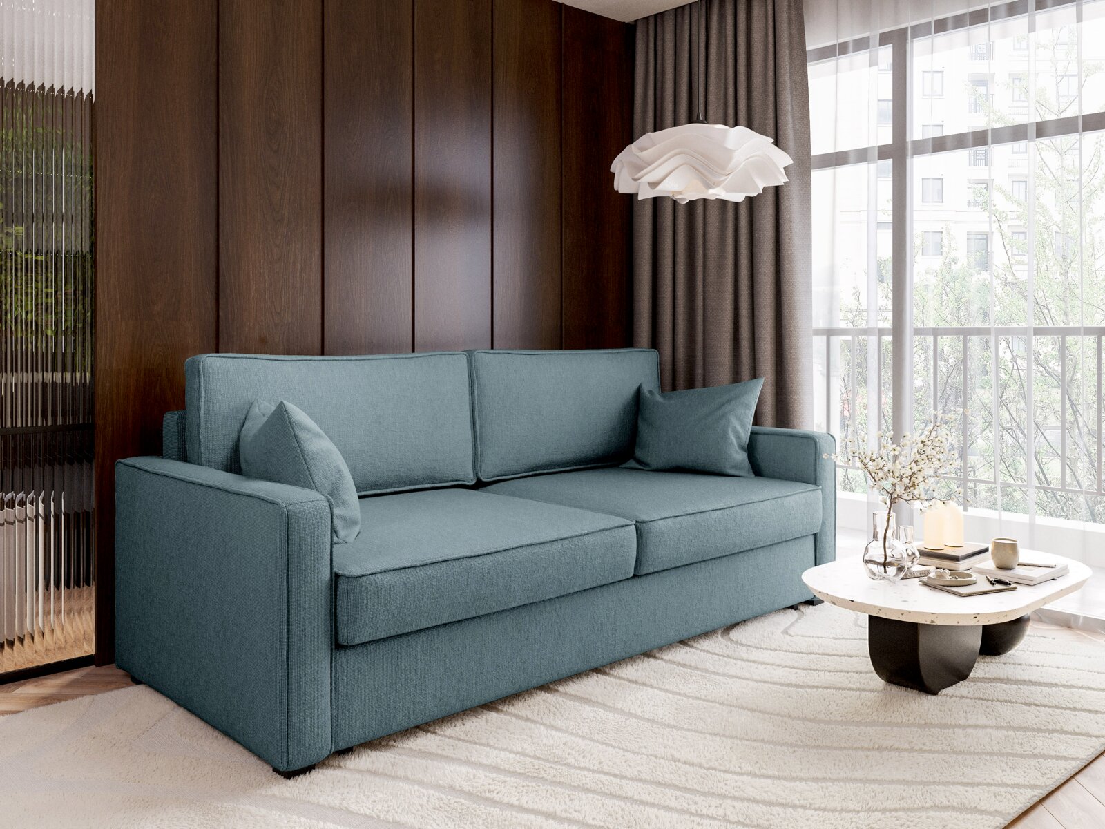Moderne functionele bank in een elegante woonkamer, gezien vanaf de zijkant, met blauwe kussens en een ronde salontafel.