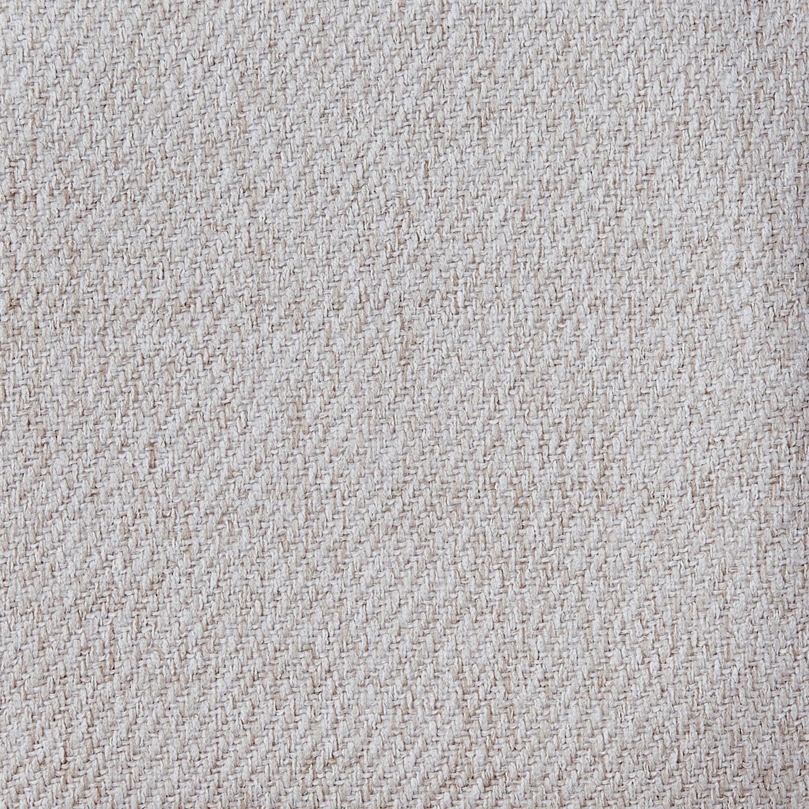 Nahaufnahme eines beigen Stoffmusters mit diagonaler Webstruktur, Draufsicht