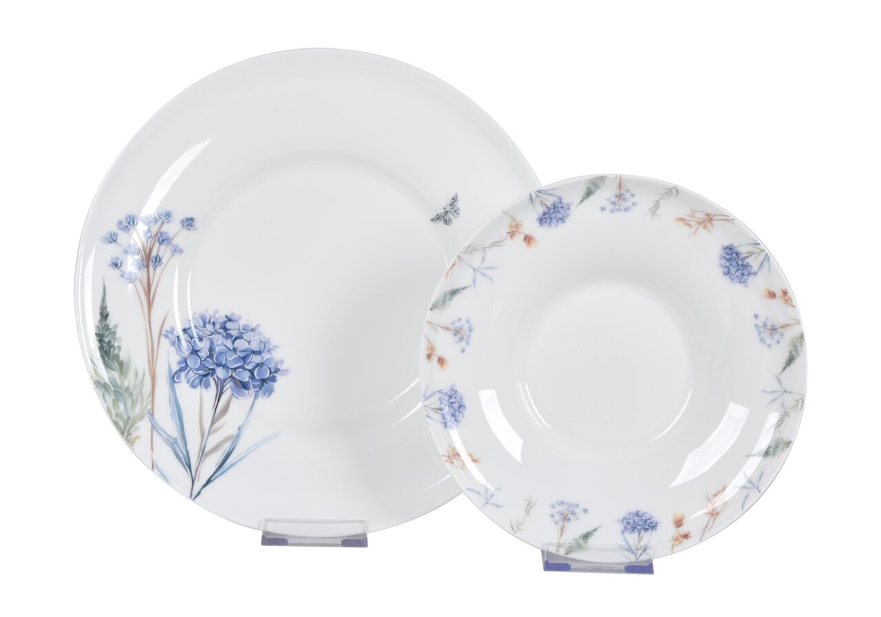 Novel Tafelservice 12-tlg. Zwei weiße Teller mit blauen und grünen Blumenmustern, frontal fotografiert.