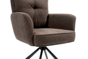 Close-up van een moderne fauteuil met een bruine, geribbelde stoffen bekleding en een zwart metalen frame, gezien vanaf de zijkant.