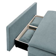 Funktionssofa in blauer Farbe mit geöffneter Stauraumfunktion, seitliche Perspektive