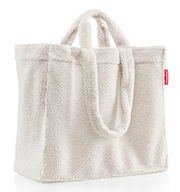 Weißer Shopper aus weichem, flauschigem Material mit zwei Griffen, seitliche Perspektive