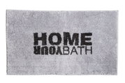 Grijs badmatje met het opschrift 'HOME YOUR BATH' in zwarte letters, gezien van bovenaf.