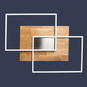 Moderne LED-Deckenleuchte mit zwei rechteckigen, weißen Rahmen und Holz- sowie Metallakzenten, aus der Vogelperspektive.