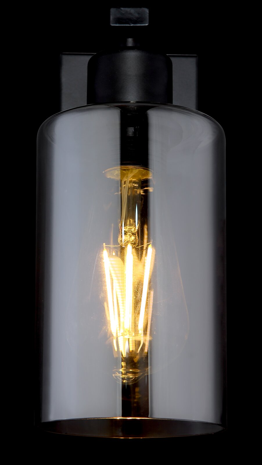 Moderne Wandleuchte mit schwarzem Sockel und transparentem Glaszylinder, seitliche Perspektive