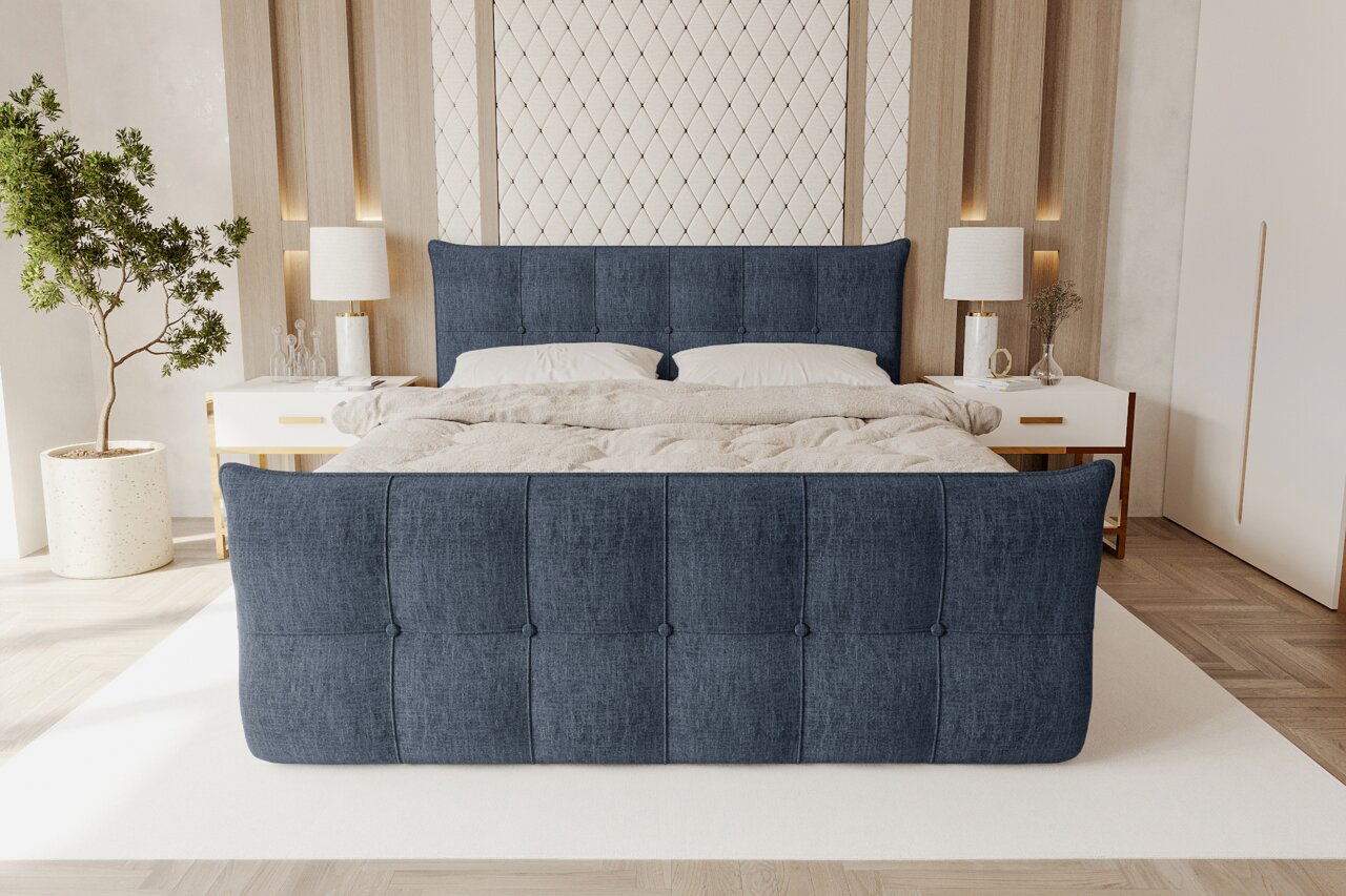 Z2 Boxspringbett LOFT V2 Modernes Polsterbett in Dunkelblau mit gepolstertem Kopf- und Fußteil, bezogen mit Stoff und Knopfheftung, im hellen Schlafzimmer mit Nachttischen und Lampen, Frontansicht von leicht erhöht
