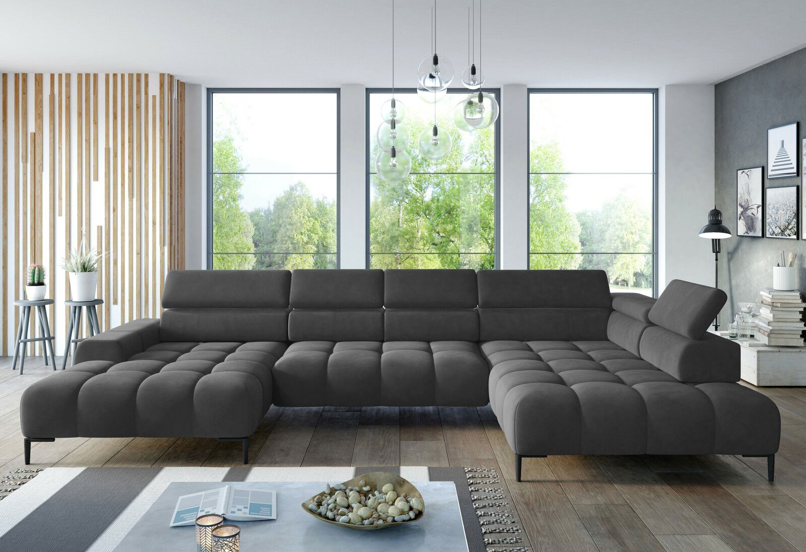Große, moderne Polsterrundecke in dunklem Grau, in einem stilvollen Wohnzimmer mit großen Fenstern und natürlichem Licht, aus frontaler Perspektive betrachtet.