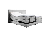 Graues Boxspringbett mit verstellbaren Matratzen, seitliche Perspektive
