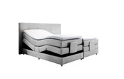 Graues Boxspringbett mit verstellbaren Matratzen, seitliche Perspektive