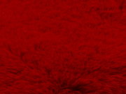 Nahaufnahme eines roten Fellteppichs mit weicher Textur