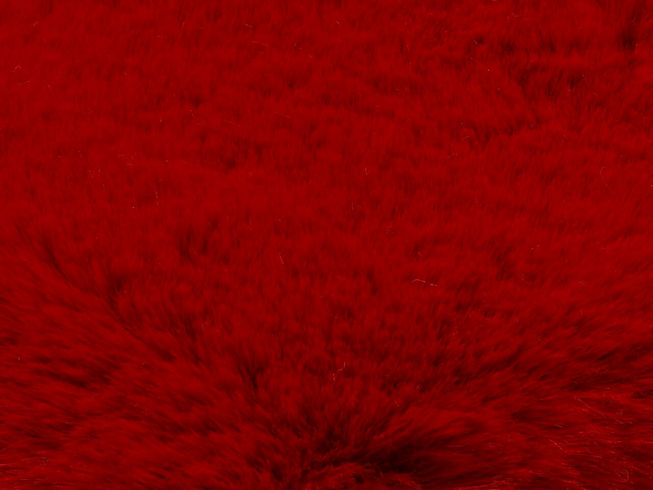 Nahaufnahme eines roten Fellteppichs mit weicher Textur