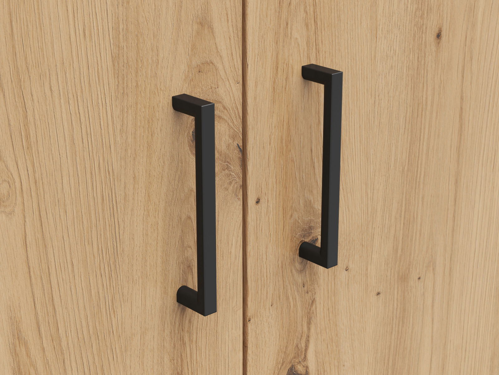 Nahaufnahme von zwei schwarzen Griffen an einer Holztür eines Mehrzweck-Kleiderschranks.