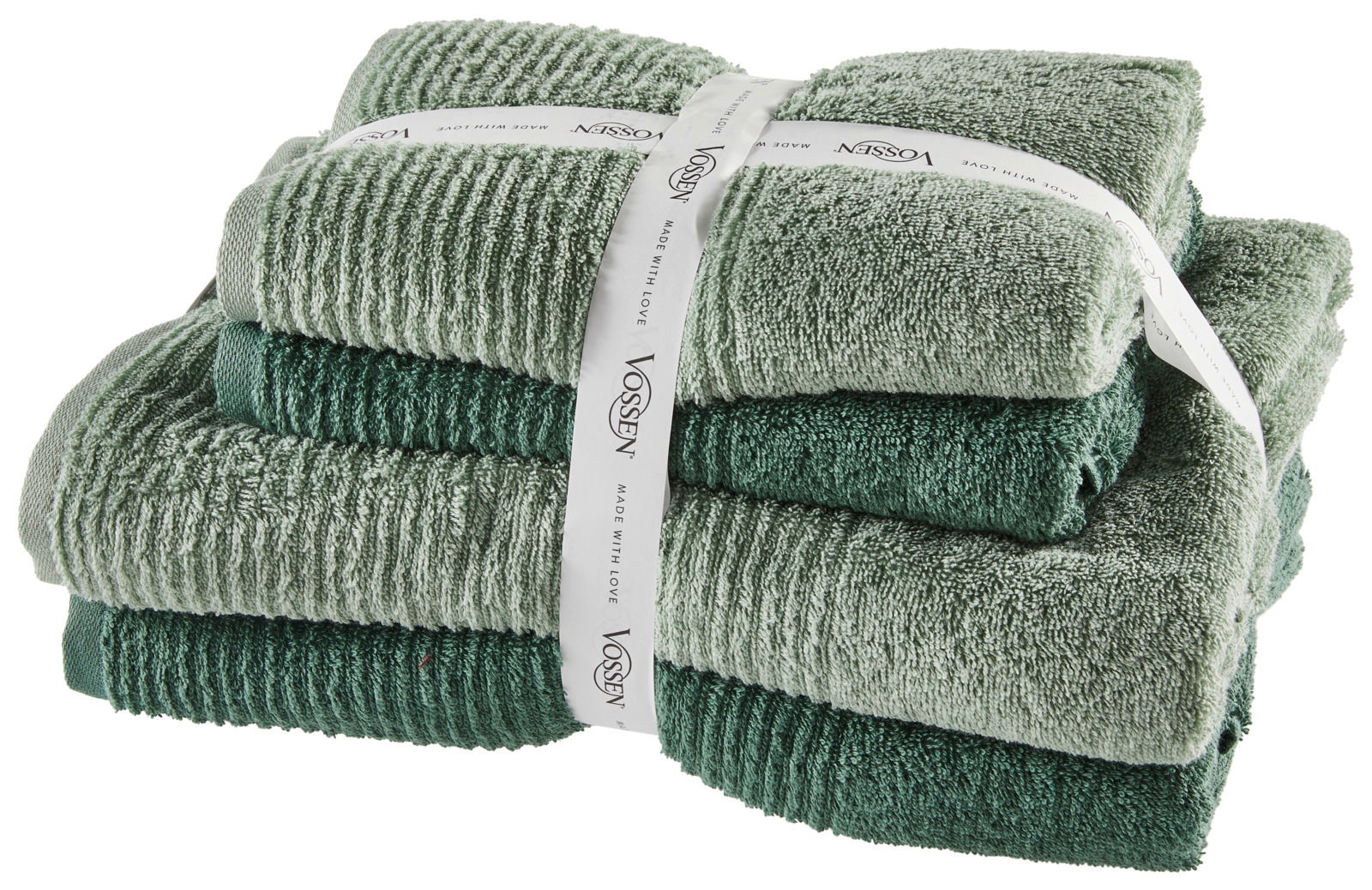 Ein Stapel grüner Handtücher, gebunden mit einem weißen Band, aus einer seitlichen Perspektive fotografiert.