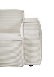 Nahaufnahme einer cremefarbenen Eckkombination mit geripptem Stoffbezug, seitliche Perspektive