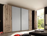 Moderner 4-türiger Kleiderschrank in Holzoptik mit Schubladen, seitlicher Perspektive