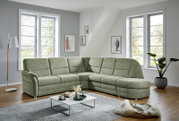 Groene hoekbank Beldomo Comfort QUEENLINE in een moderne woonkamer, zijaanzicht.