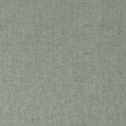 Nahaufnahme eines grünen Stoffes mit feiner Webstruktur, verwendet für Wendebettwäsche.