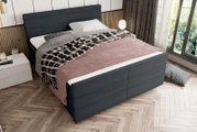 Boxspringbett in modernem Schlafzimmer, seitliche Perspektive